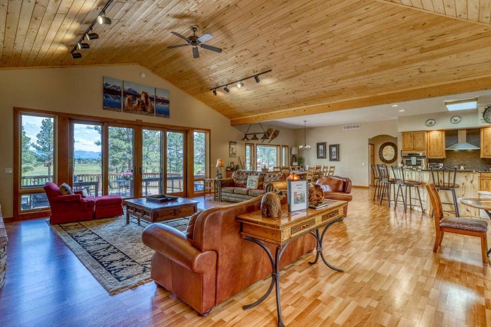 Beautiful View from the Living Room and open concept kitchen dining space. This house is perfect for multi families or larger groups of friends.