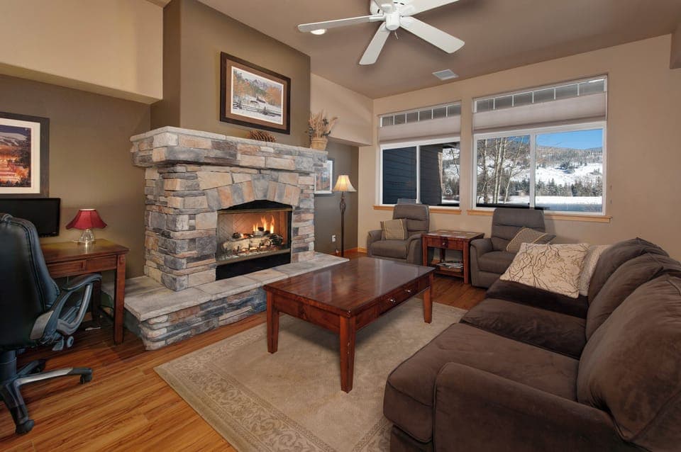 Main level living area with smart TV and gas fireplace.