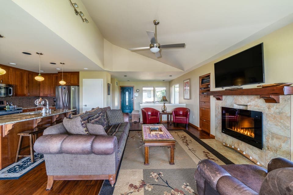 Updated living room with electric fireplace & lake views