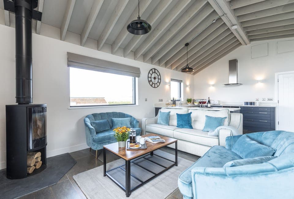 Fern, Ansty: The open-plan living area with wood burning stove