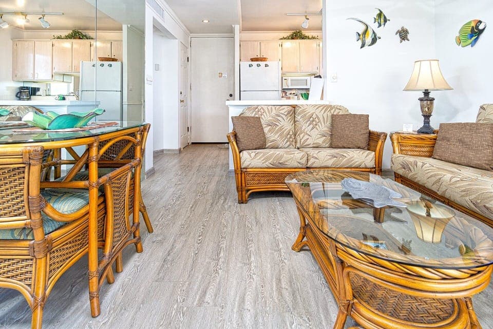 Bright living area with wide ocean views and the sound of waves filling the space.