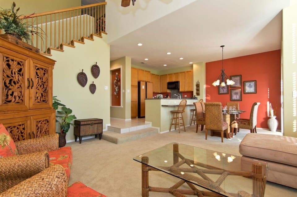 Open concept layout connects living room, dining, and kitchen