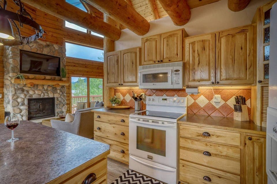 Fully equipped kitchen with modern home equipment, open concept for easy entertaining and a views of Pagosa Peak.