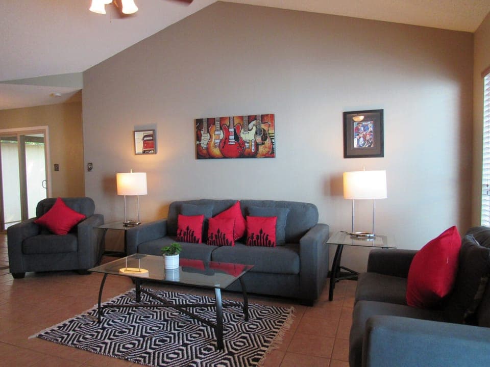 Austin music themed living room with fireplace and SmarTv above the mantle