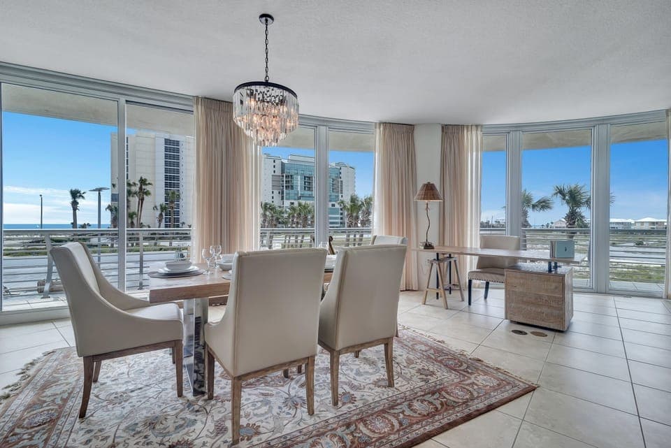 Imagine yourself in this high-end luxury condo, where the open layout flows effortlessly from the well-equipped kitchen to the spacious living and dining areas, all while being just a stroll away from Flora-Bama.