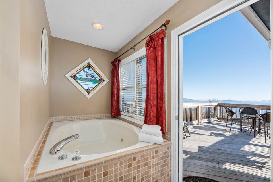 Jacuzzi jetted tub in the Peanut Butter Room — soak with mountain views through the window