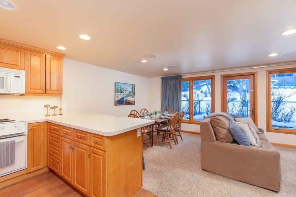 Open concept living room, kitchen, and dining area