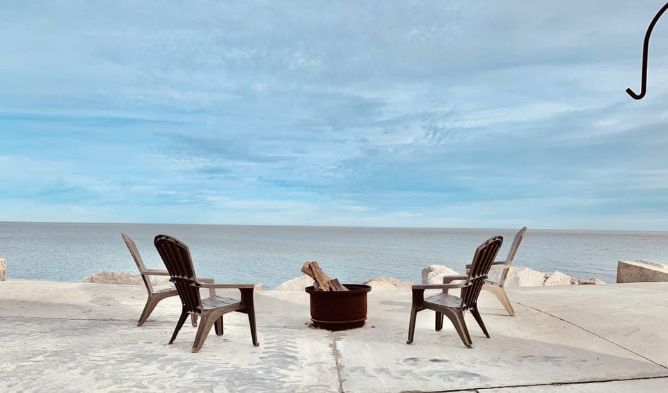 Large patio, firepit, sunrise and sunset views