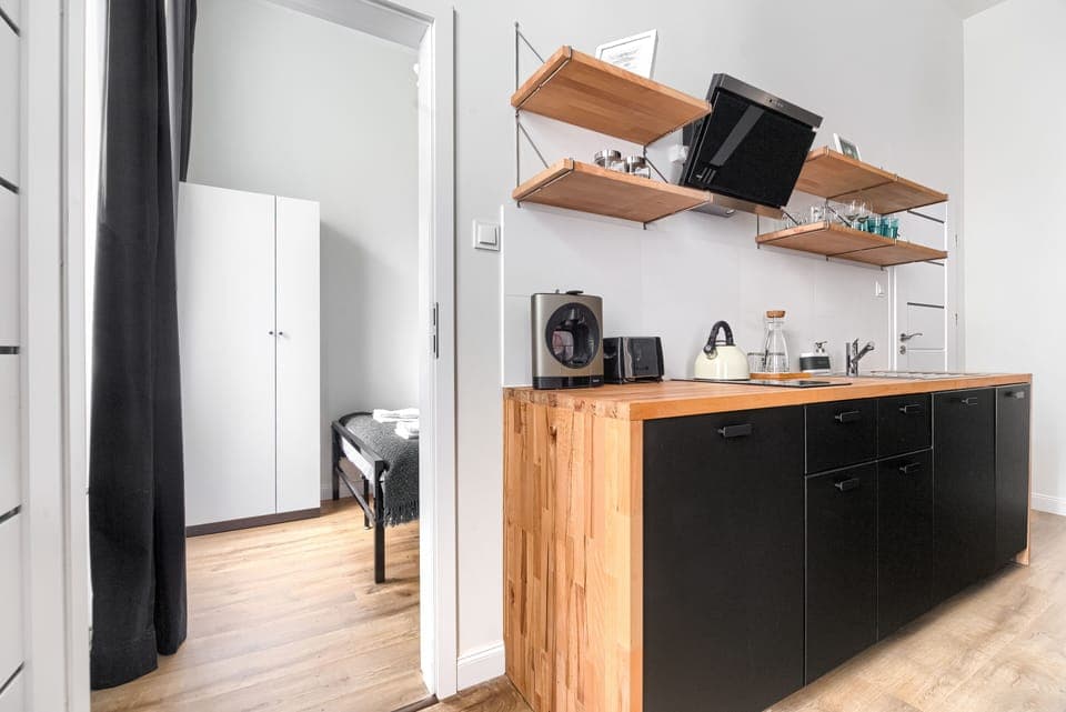 Superior Apartment | Private kitchenette | Full-size fridge, stovetop, dishwasher, electric kettle
