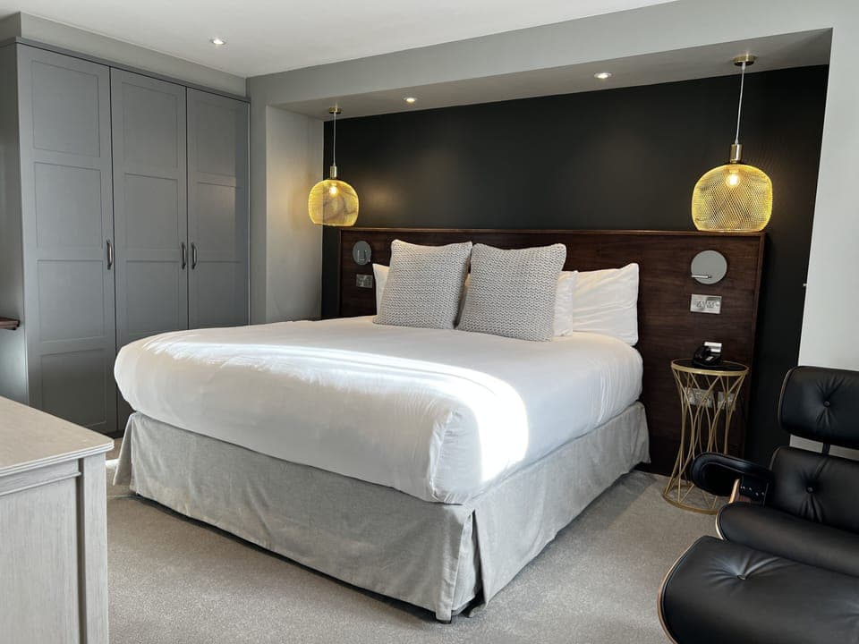 Signature Suite | In-room safe, desk, laptop workspace, iron/ironing board