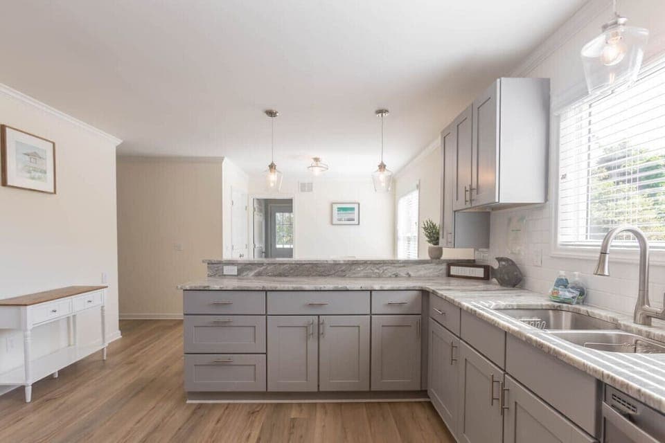 A large kitchen can be found on the main floor in the heart of the home. Enjoy a gas range, oven, full size refrigerator, microwave, dishwasher, and all the basics you need for cooking. We also provide dining ware for kids and a coffee pot.