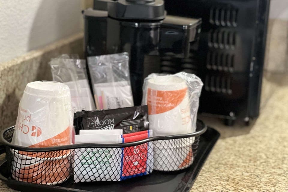 Premium bedding, desk, laptop workspace, iron/ironing board