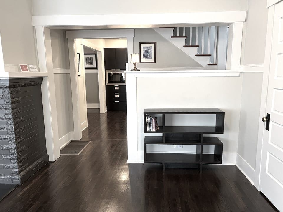 Entry area with closet and powder room to the right.