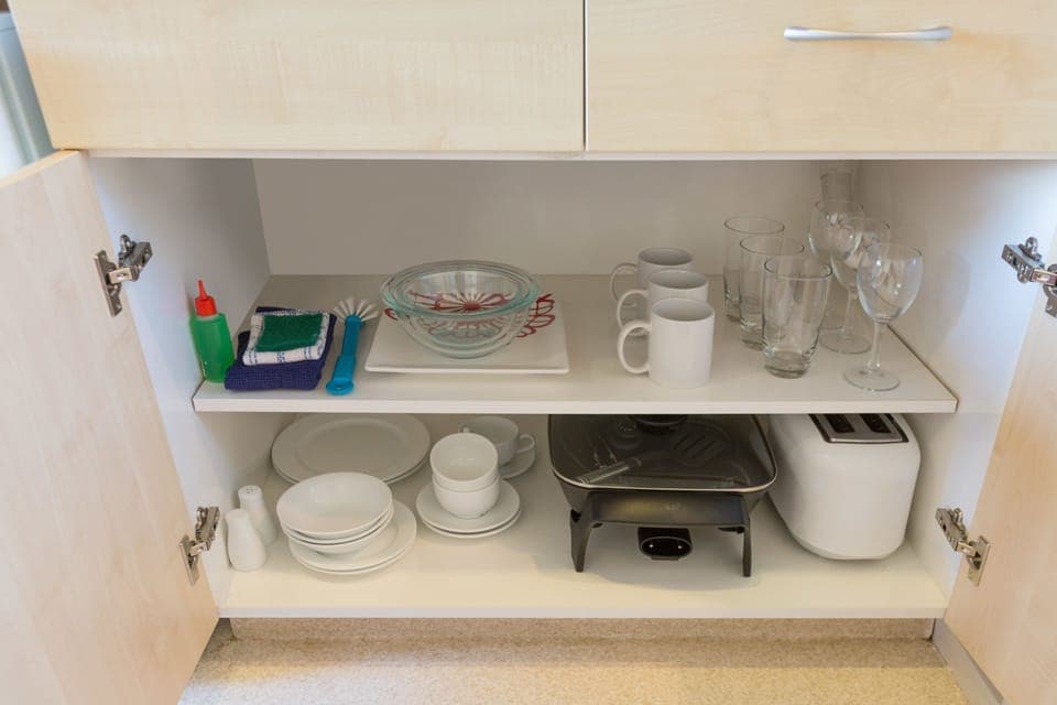 Fridge, microwave, coffee/tea maker, cookware/dishes/utensils