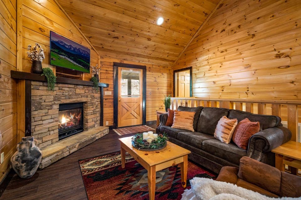 Main Living Area Upstairs with Pull Out Sofa, Recliner, Fireplace, and Smart TV