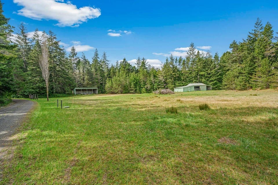 Extra parking area in field. There is 1/2 mile of gravel road off Highway 101 to reach house.