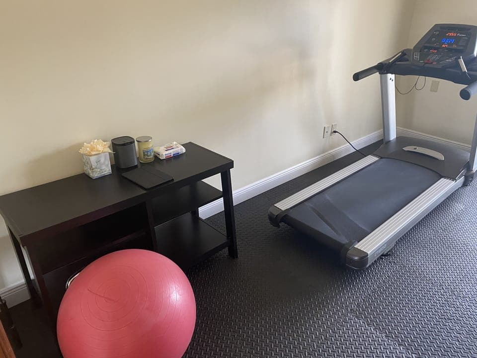 Exercise room with treadmill & Sonos sound system. 