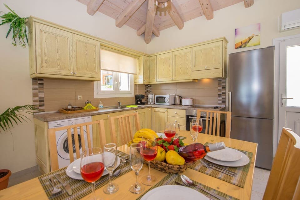 Villas Porto Kamini in Afionas Corfu Kitchen And Dining Area 