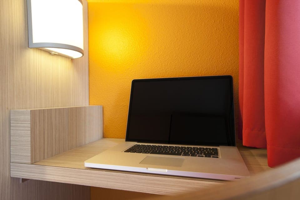 Individually furnished, desk, laptop workspace, blackout drapes