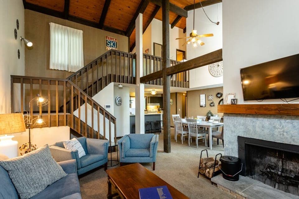 Living Room with high vaulted ceilings and fireplace