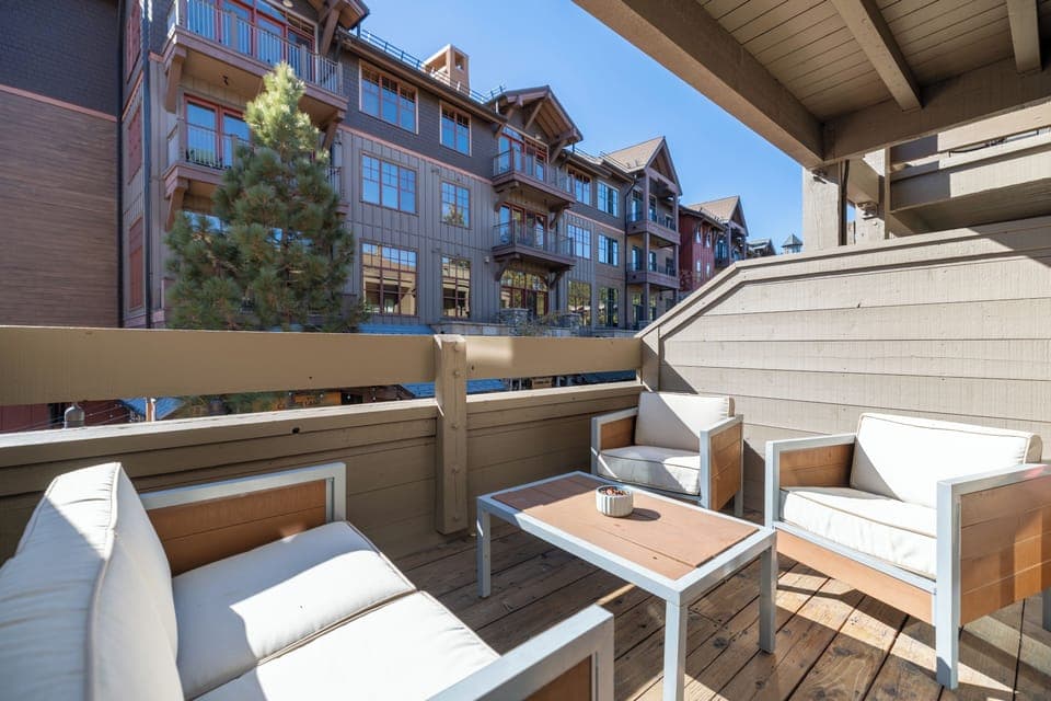 Sunny balcony with seating.