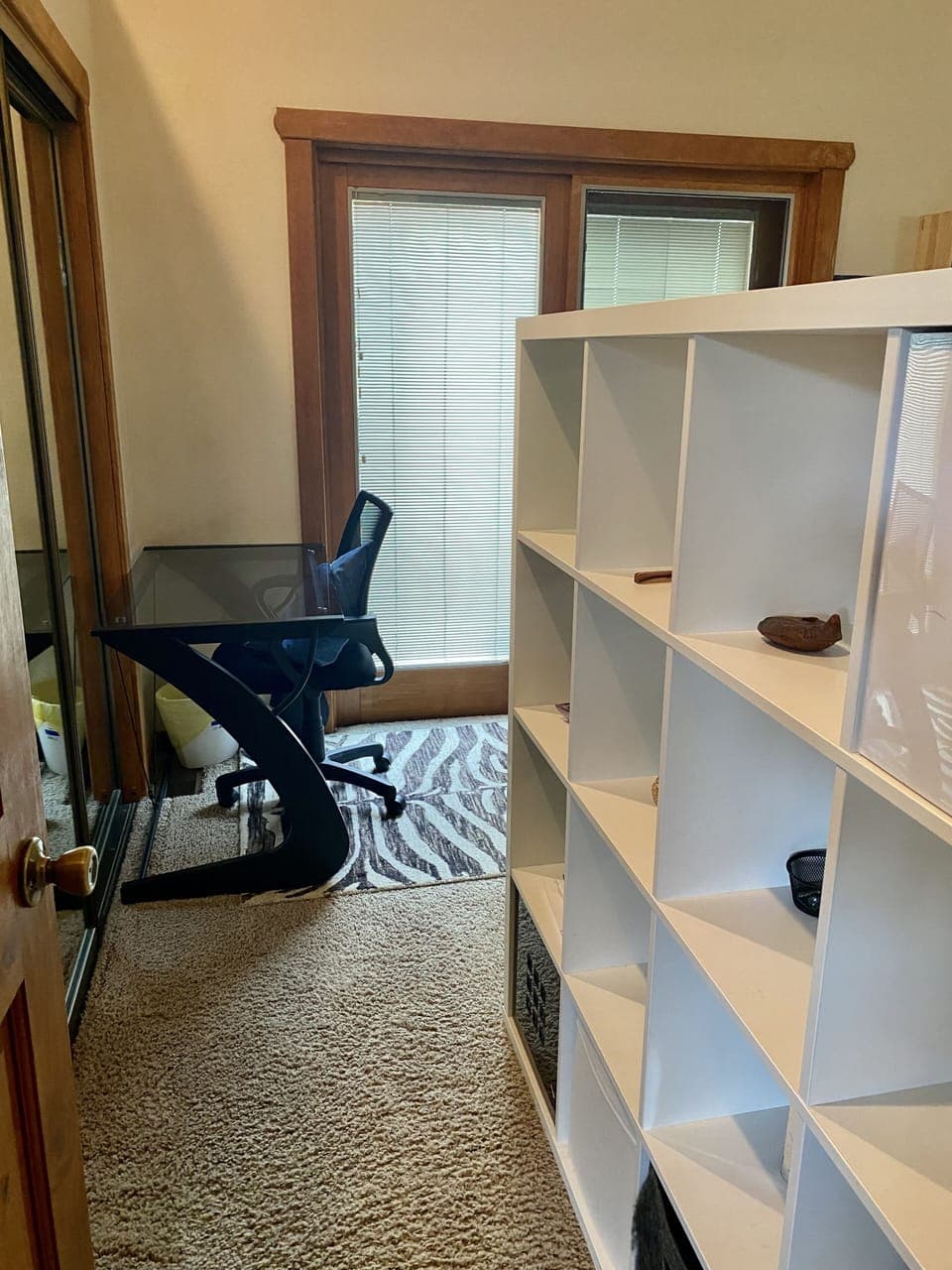 View from the hallway door of the 2nd bedroom upstairs with a king bed & slider
