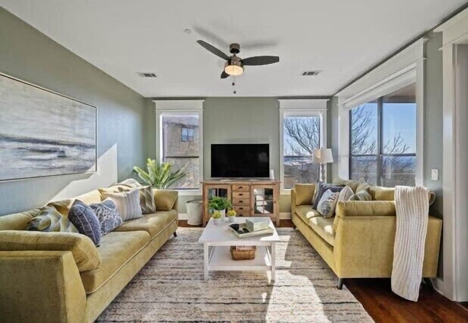 Family room with couch that makes into a queen bed and 65" screen 