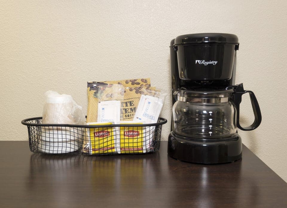 Desk, laptop workspace, blackout drapes, iron/ironing board