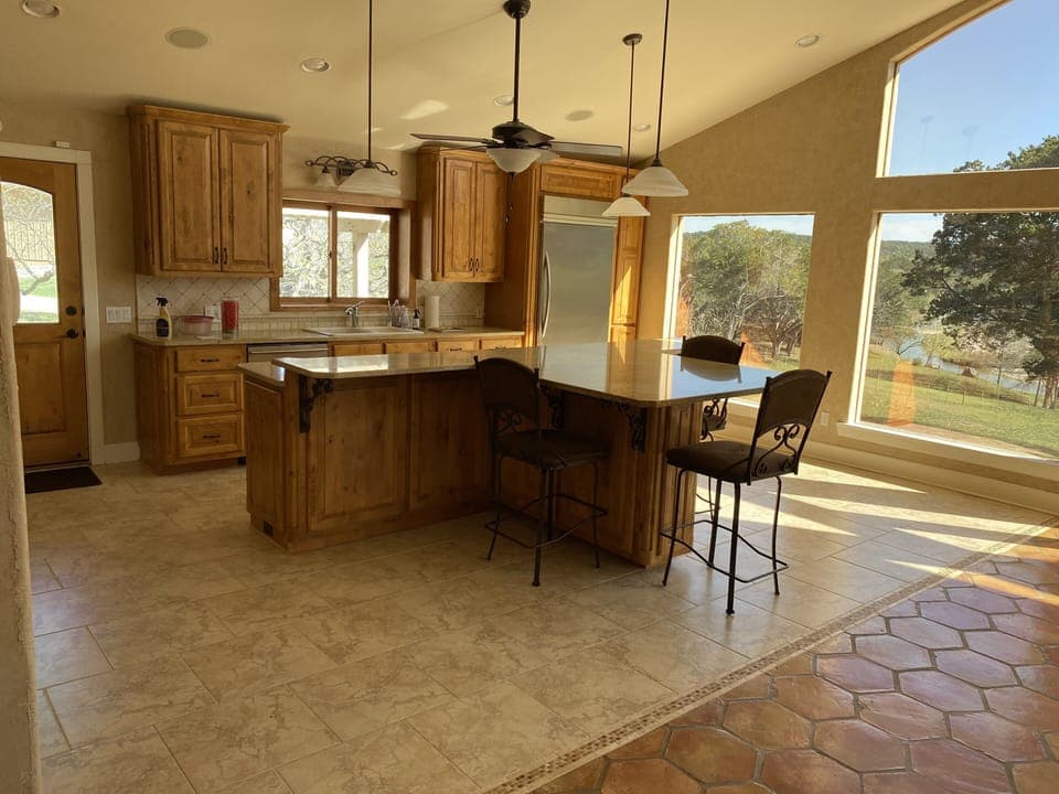 Open gourmet kitchen with electric appliances Double oven, dishwasher, ice-maker