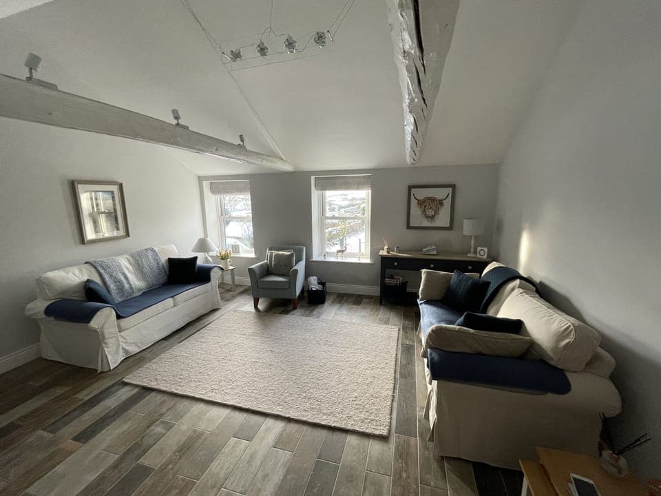 Modern living room with views of Coverdale. 