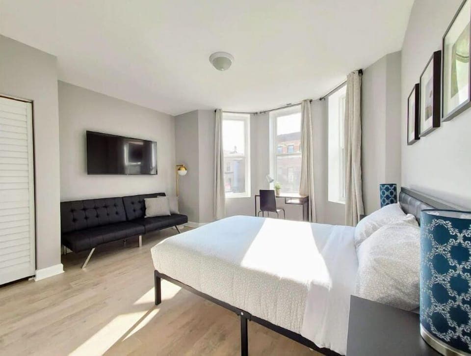 Bedroom #1 with full size bed and sofa bed, Roku TV and in-suite bathroom