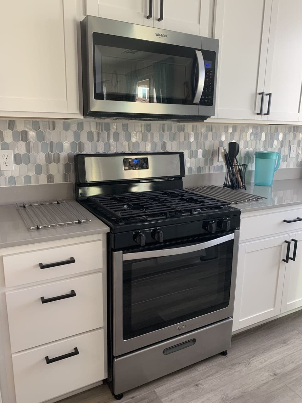 Gas stove and overhead microwave are installed fir your cooking