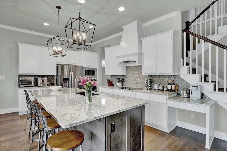 Beautiful kitchen with large island and top of the line appliances.