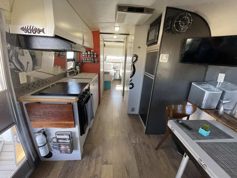 Airstream kitchen includes 3 burner stove, small oven, small microwave, and sink. The Airstream fridge should only be used for dry storage.