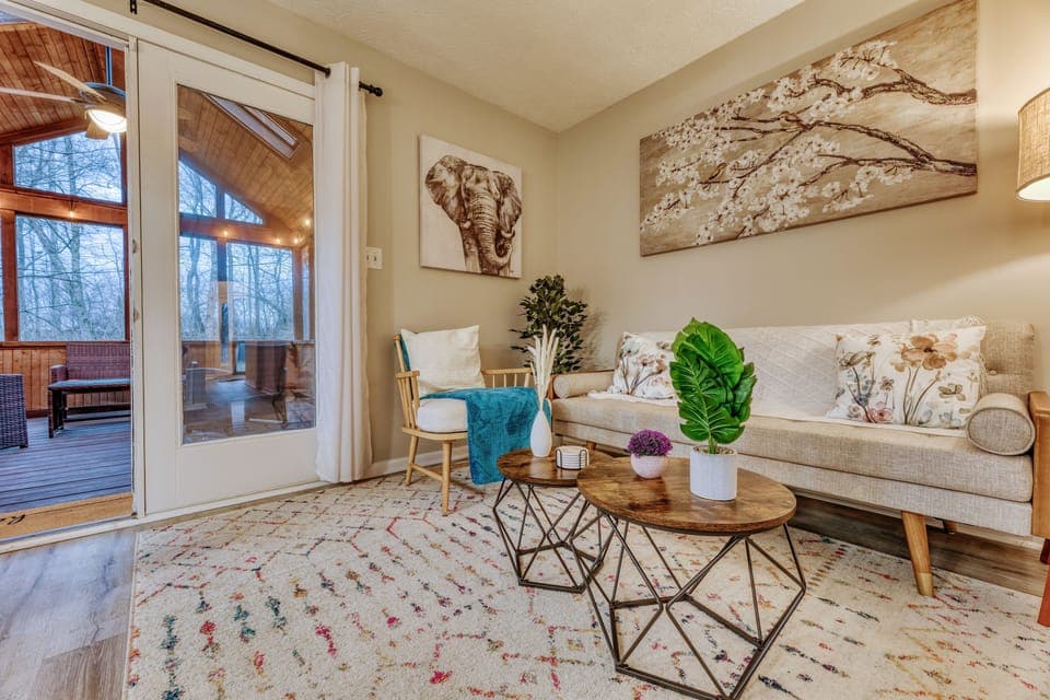 Secondary living room that opens to the screened in porch.
