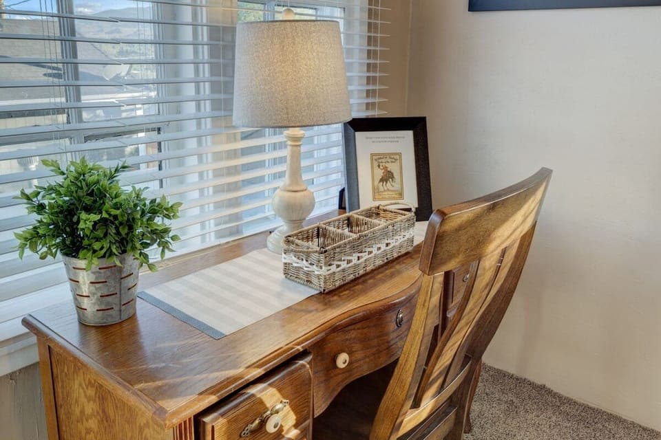 This home makes working remotely easy! This master bedroom has a desk for your to use.  #stayrenostonehouse