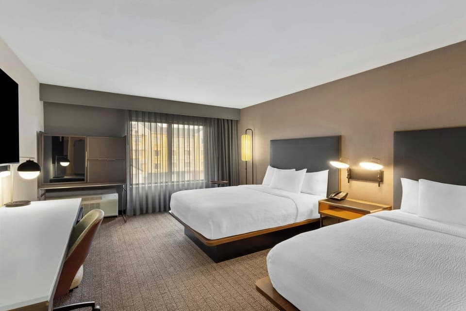 Hypo-allergenic bedding, desk, blackout drapes, iron/ironing board