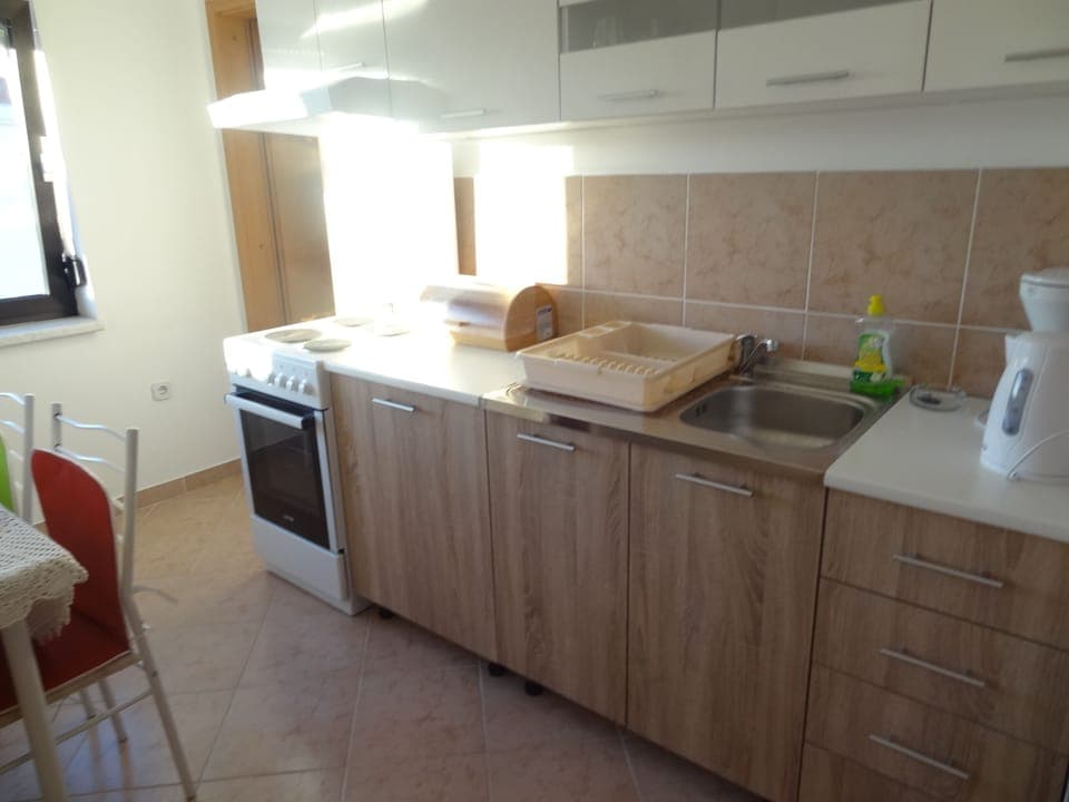 Apartment, 2 Bedrooms, Smoking, Balcony | Private kitchen | Fridge, electric kettle, cookware/dishes/utensils, dining tables