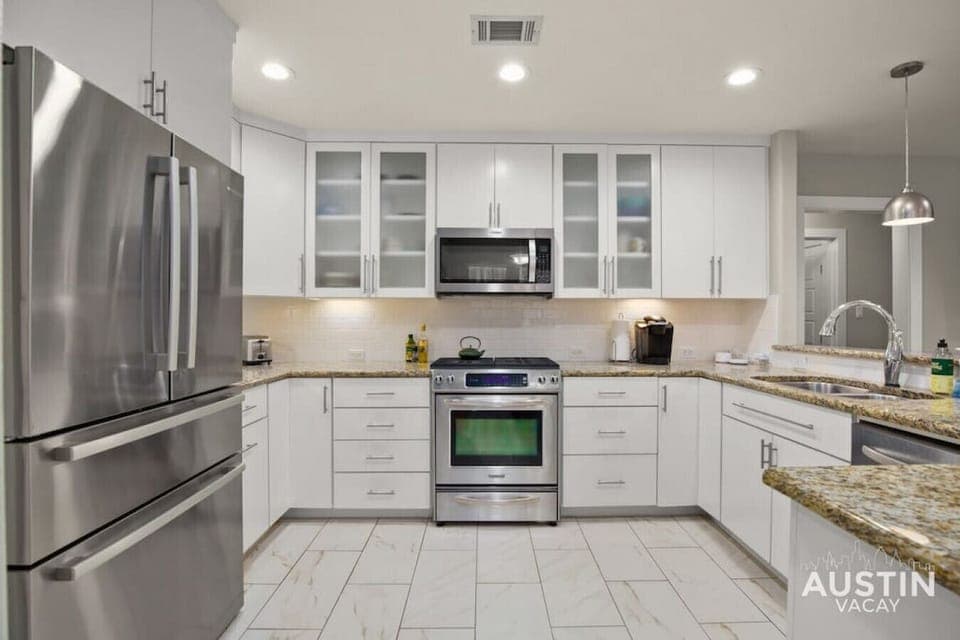 Large kitchen with bar seating and dining area