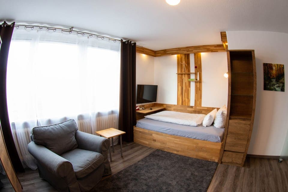 Comfort Studio | Living area | Flat-screen TV