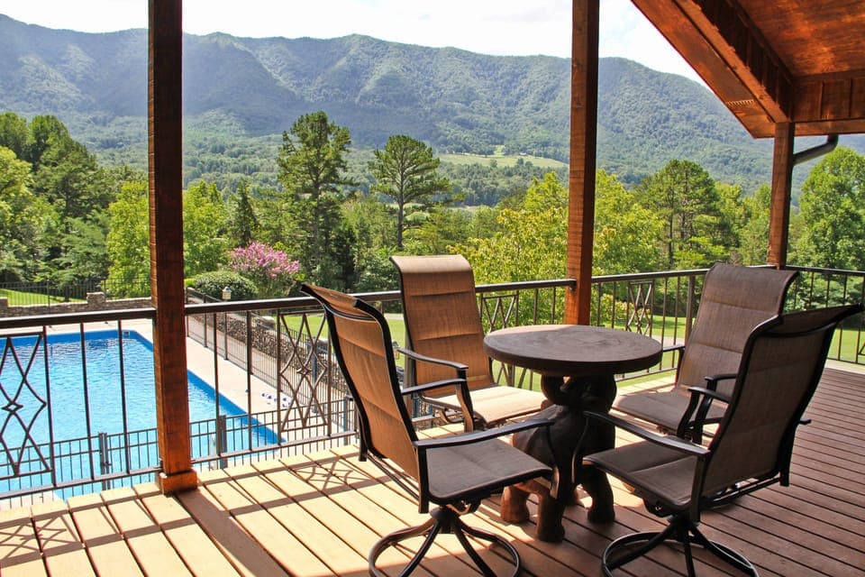 Covered balcony overlooking the private seasonal pool and the Smoky Mountains.
