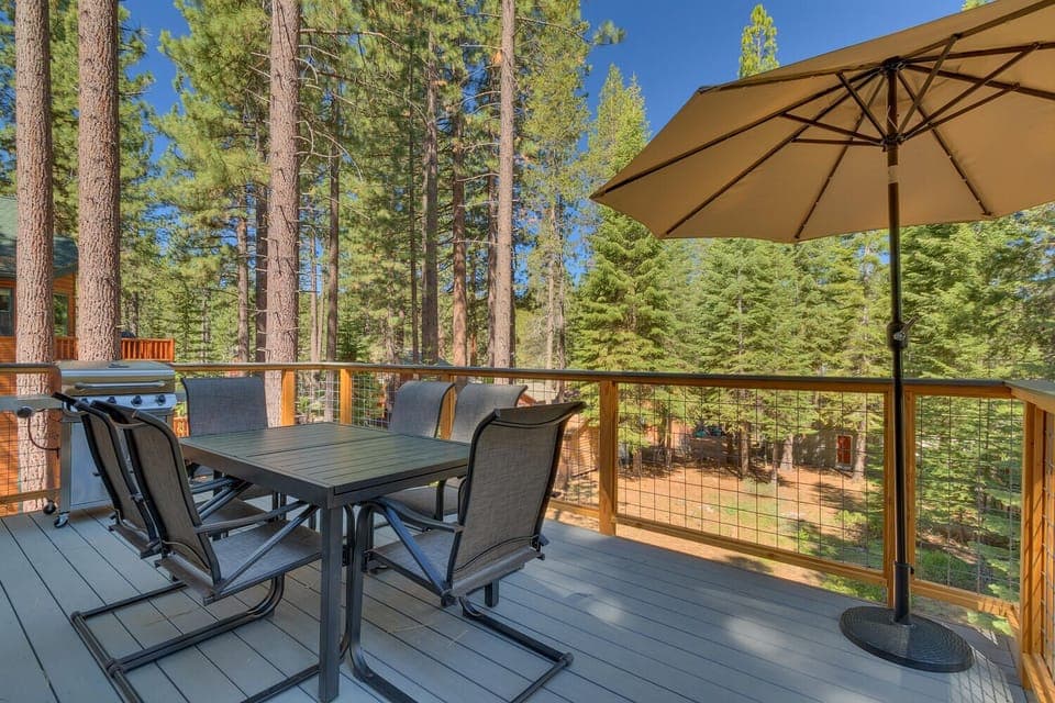 - Forest view deck with outdoor dining  
- BBQ grill and umbrella shade setup  
- Relax in fresh mountain air retreat