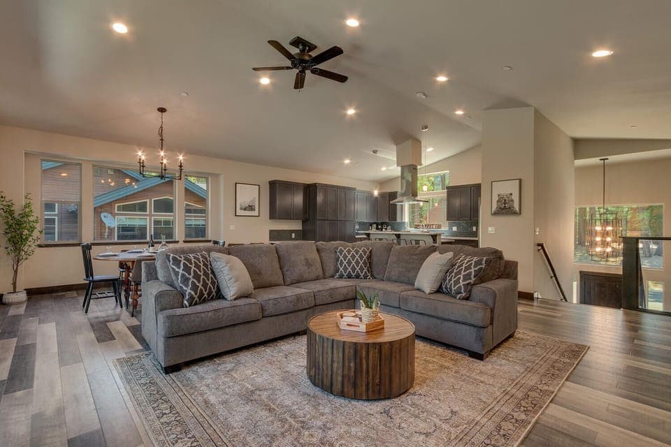 - Spacious living room with sectional sofa  
- Open concept layout with modern design  
- Cozy cabin stay near Lake Tahoe