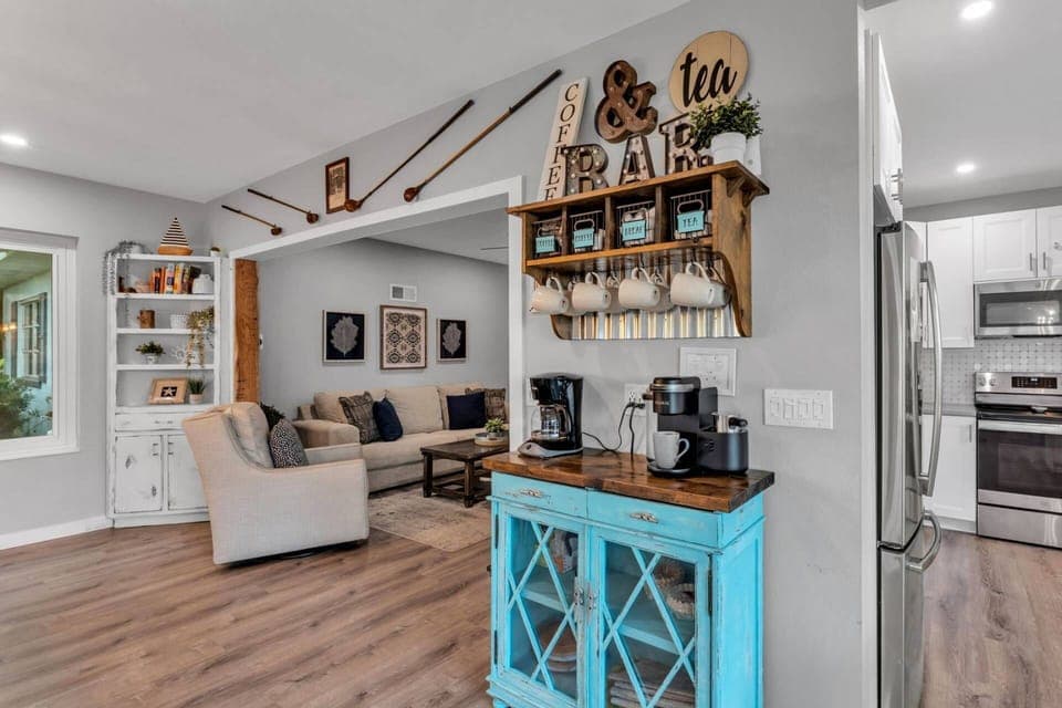 Open living area with coffee bar, built-ins, and inviting seating.