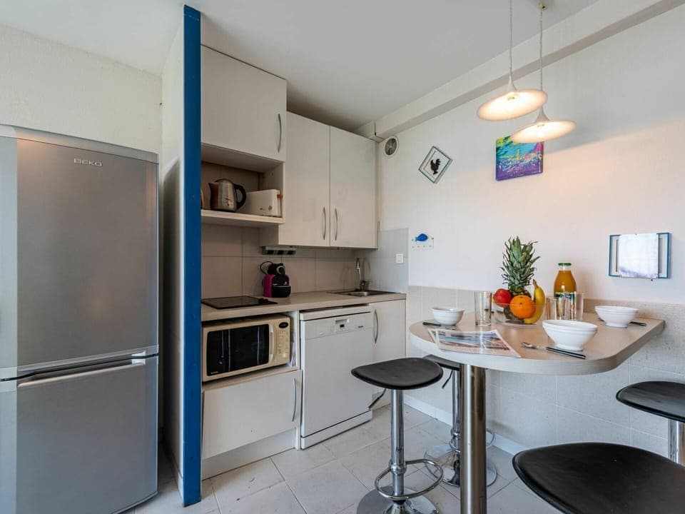 Furniture, Cabinetry, Countertop, Building, Kitchen Appliance, Kitchen, Interior Design, Kitchen Stove, Home Appliance, Table