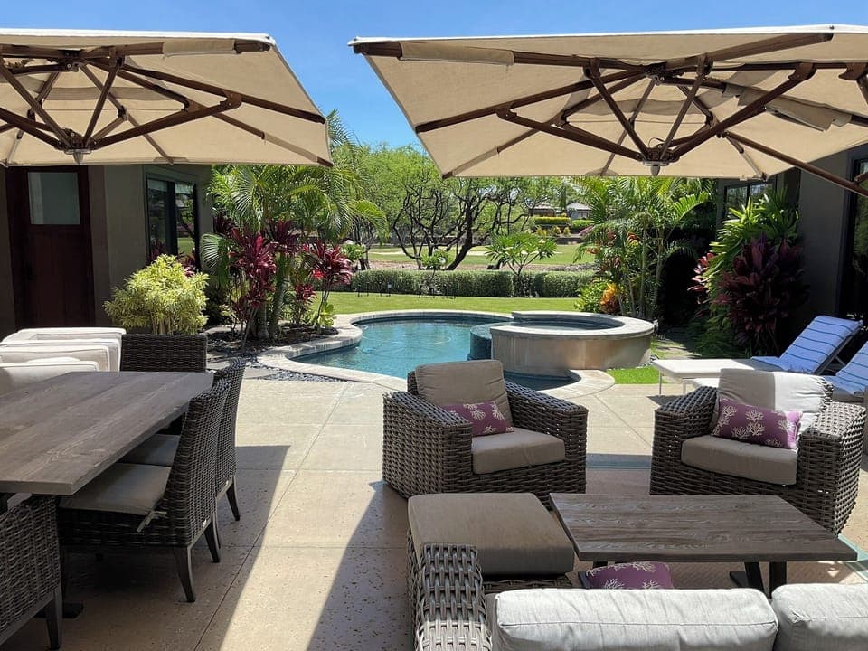 Relax and enjoy the beautiful tropical garden with views of the golf course