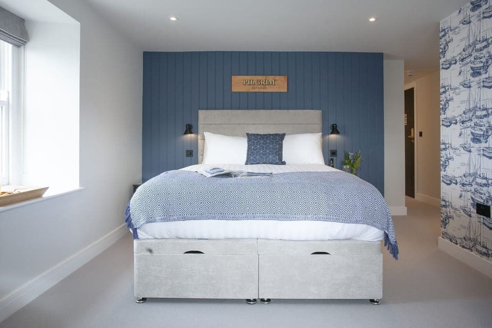 King size bed with under bed storage and bed side lighting - Pilgrim Suite