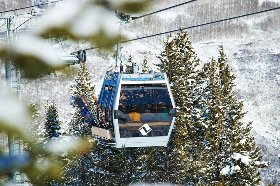 Glide up the mountain in the cozy gondola, surrounded by breathtaking winter landscapes.