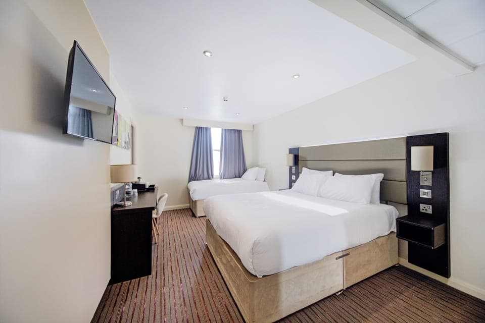 Family Triple Room, Multiple Beds | Individually decorated, individually furnished, desk, iron/ironing board