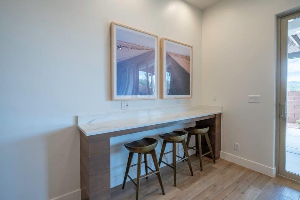 Additional bar seating for 3 (located behind the dining room table)